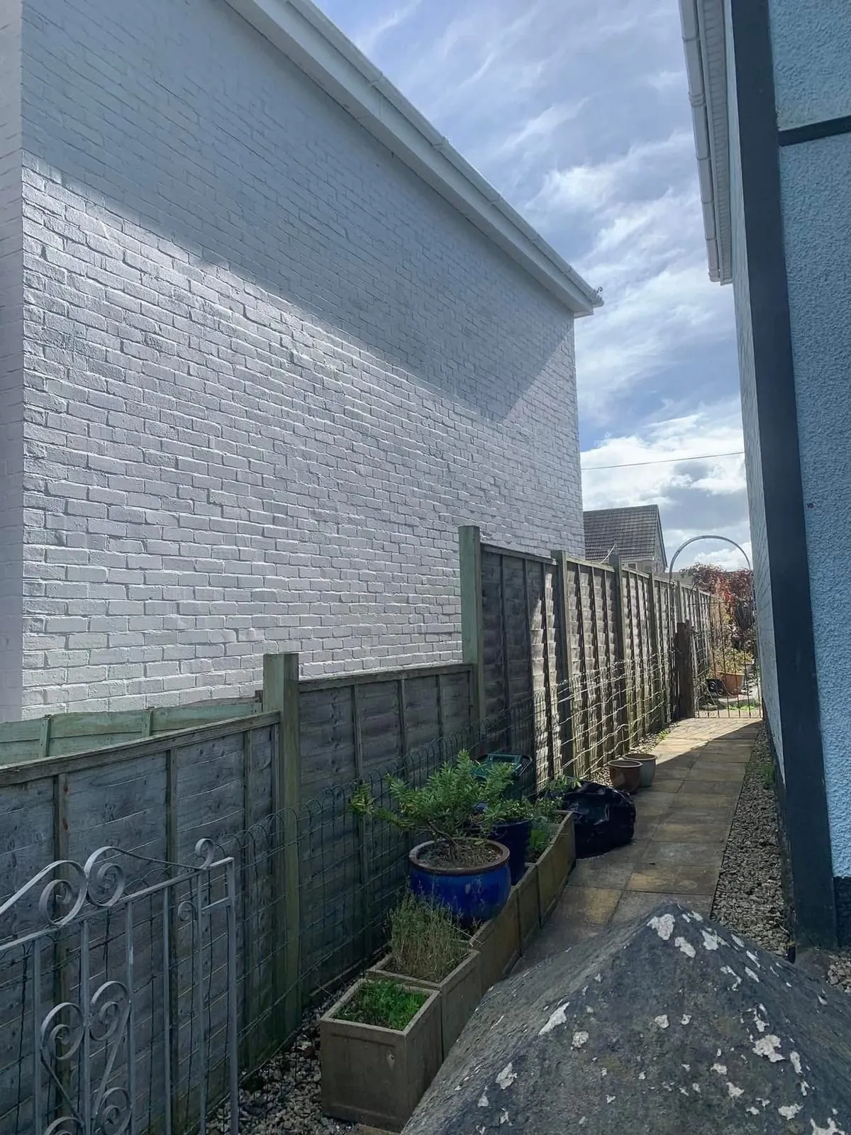 Freshly painted brick wall after preparation and masonry paint in Kingsbridge